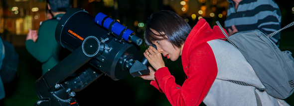Students using a telescope