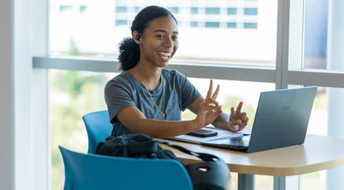 Mission College student waving