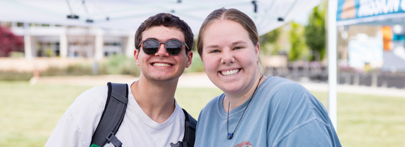 Two students smiling