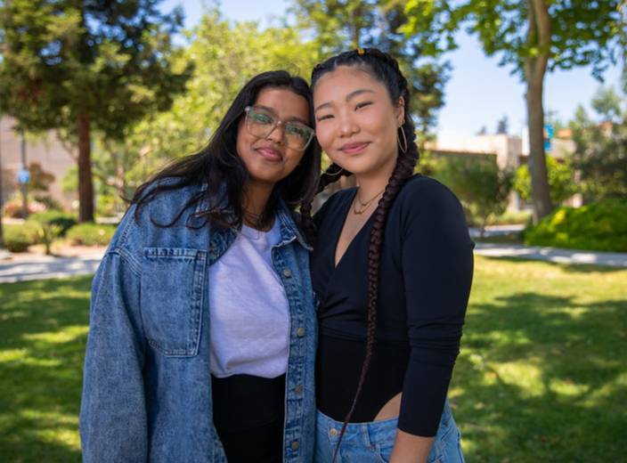 Two young women on quad.