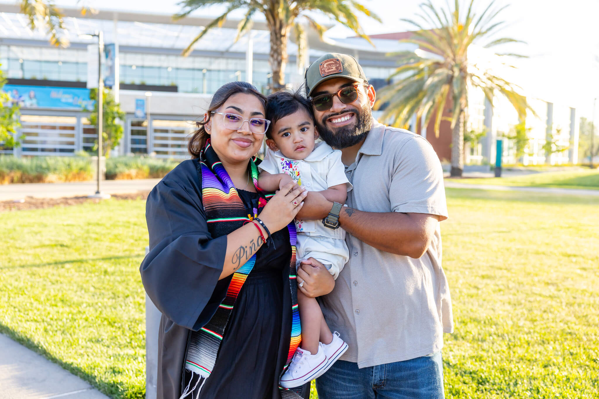 Mission College graduate with family