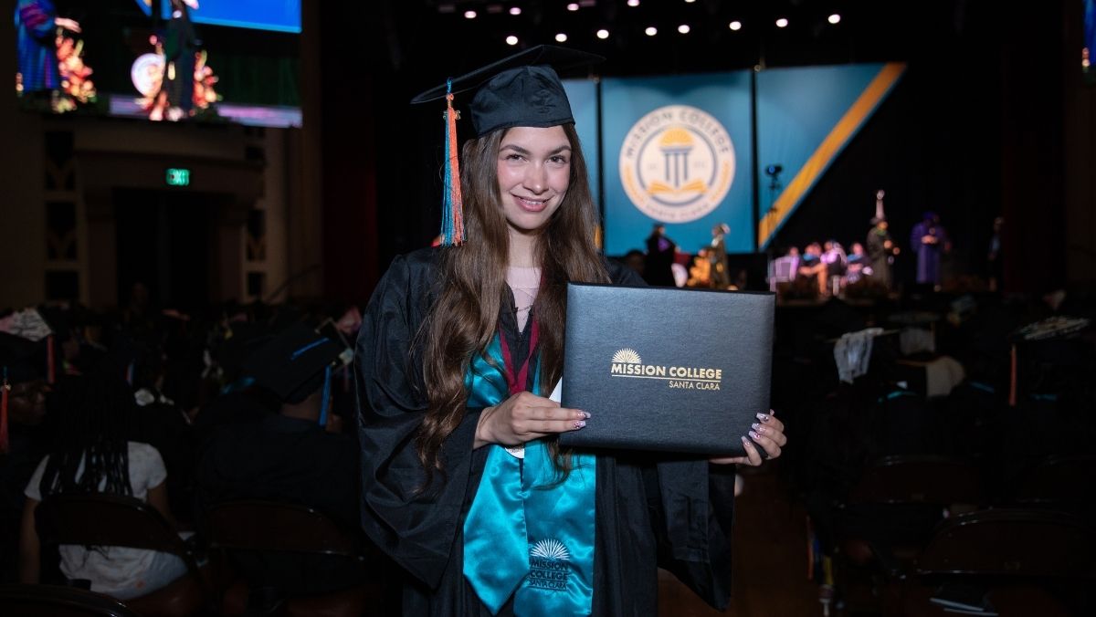 Mission College student holding degree